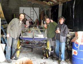 Mickaël, Jimmy and Bruno renovating the Roulopia wagon (roulopa+equipia=roulopia)