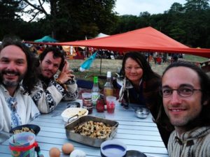 Mickaël; Jean, Jade and Florian in front of the tent set up at the festival